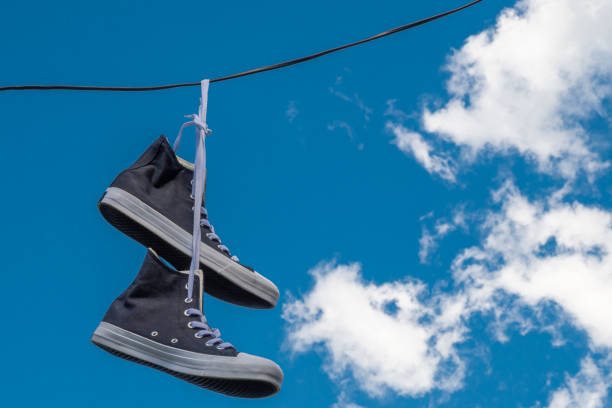 istock Sneakers hanging on electric wires. 1346809012