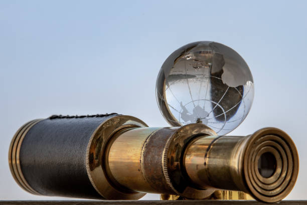 istock Vintage Binocular and Crystal Globe with Sky Background. Travel Concept. 1346814756