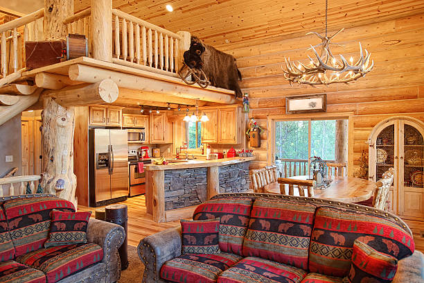 Log Home Interior The interior of a modern log cabin antler chandelier stock pictures, royalty-free photos & images
