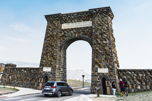 Gardiner, Montana, USA. Sep 04 2021: The Roosevelt Arch is located at the north entrance of Yellowstone National Park and was laid by President Theodore Roosevelt in 1903.