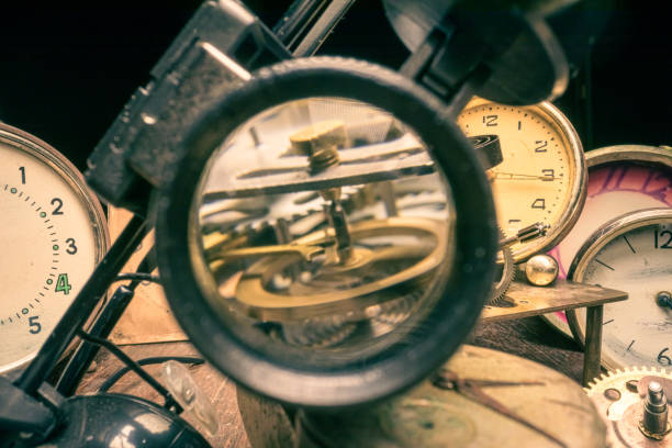 istock Old watchmakers workshop with broken clocks and parts 1346823296