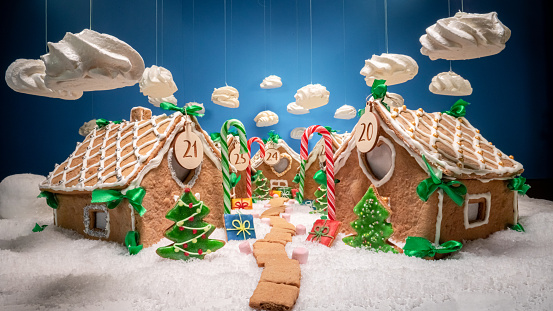 Stunning Christmas gingerbread village with meringue clouds and treats. Gingerbread village for Christmas.