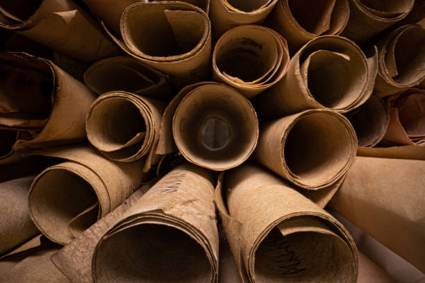 istock Ancient scribe library. Scrolls with futhpak symbols stacked on pile. 1346823918