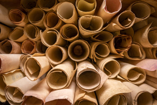istock Scribe library. Retro futhpak scrolls stacked on a pile. 1346823927