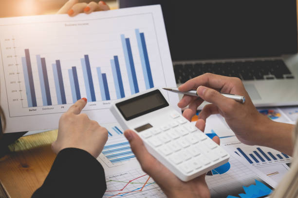 istock Business team working together and training to analyze technical price graph and indicator. 1346824234