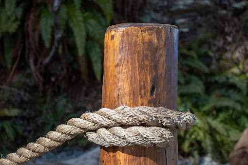 wooden fence post and twisted rope line at Port Renfrew, British Columbia, Canada