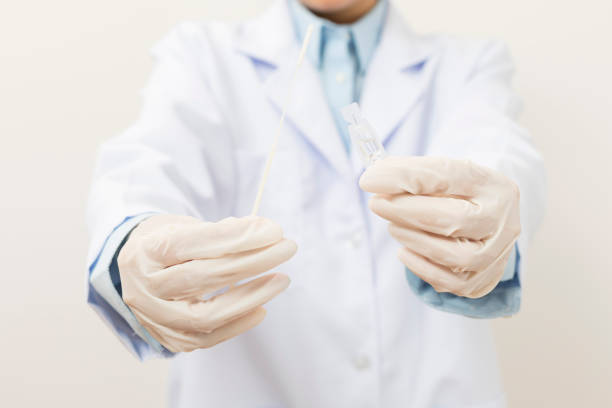 istock Medical personnel holding Antigen Test Kit (ATK) 1346825728