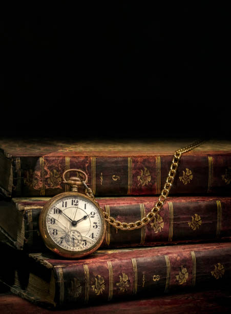 istock Old vintage pocket watch and books 1346831065