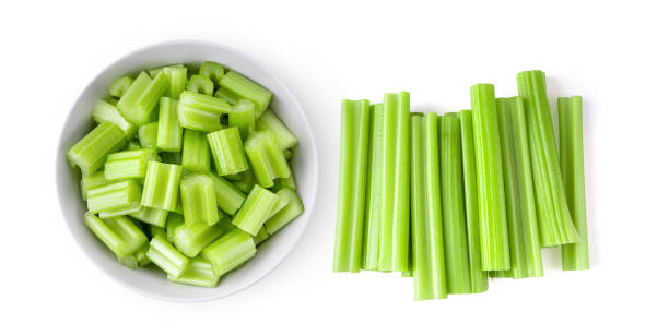 istock Top view of celery in white bowl isolated on white background. top view 1346837072