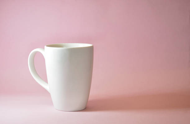 istock white coffee mug with pink background 1346842272