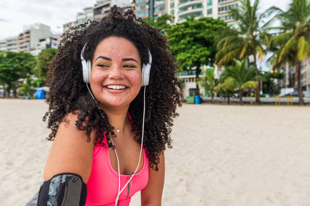 istock Beautiful chubby woman on the beach, exercise 1346843883