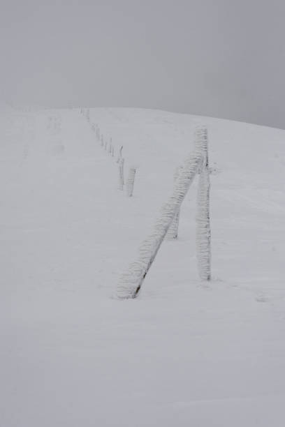 istock Snow and ice-covered signpost located on the mountainside. 1346847195