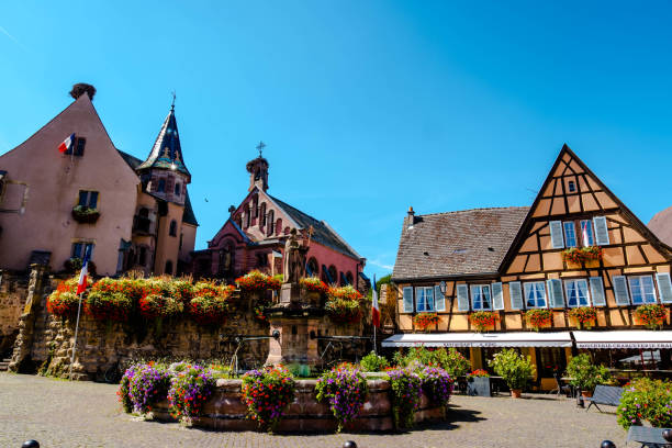 istock Eguisheim Square with its old Romanesque church 1346850046