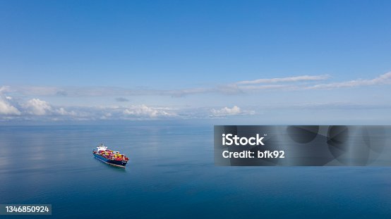 istock Cargo ship in the ocean. 1346850924