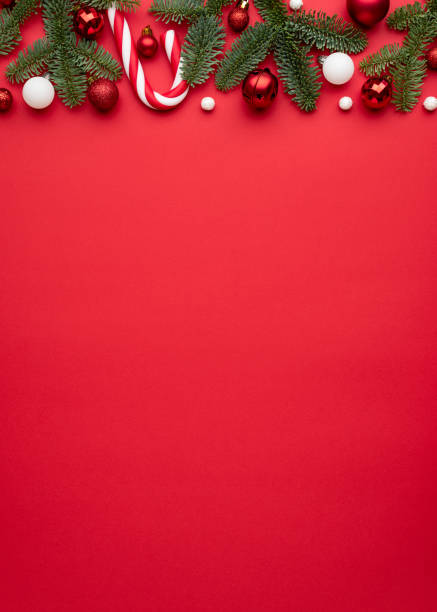 istock Christmas or New Year red background with fir decor 1346851843