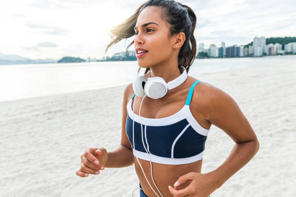 istock The young athlete enjoys exercising on the beach 1346853633