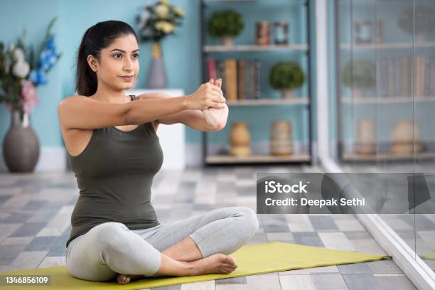 Beautiful Attractive Young Woman Doing Yoga Exercising At Home Health Concept Fitness Concept Stock Photo Stock Photo - Download Image Now