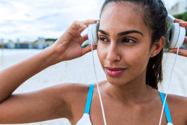 istock The young athlete enjoys exercising on the beach 1346856491