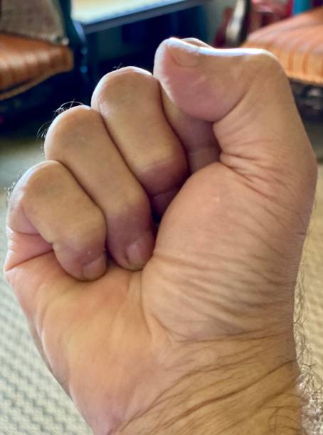 istock Fingers clinched as a fist 1346858371