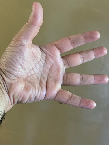 Human hand spreading all five