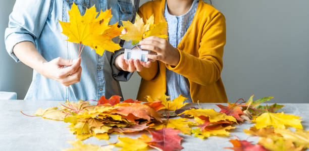 istock Happy family doing autumn decor. Fall atmosphere 1346860771