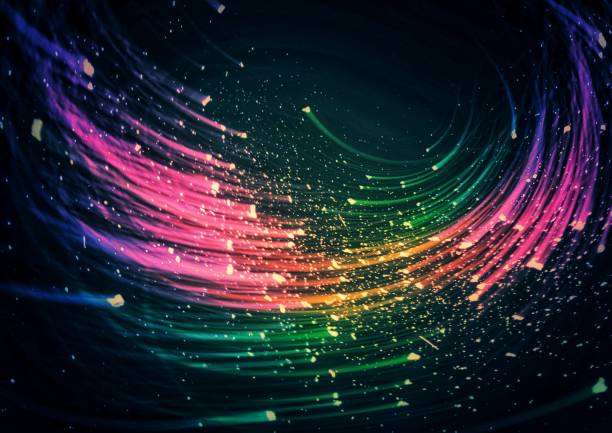 istock Abstract background swirling with colorful lights 1346862529
