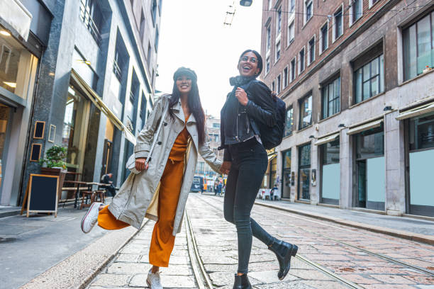 istock Beautiful young women exploring the city 1346863989