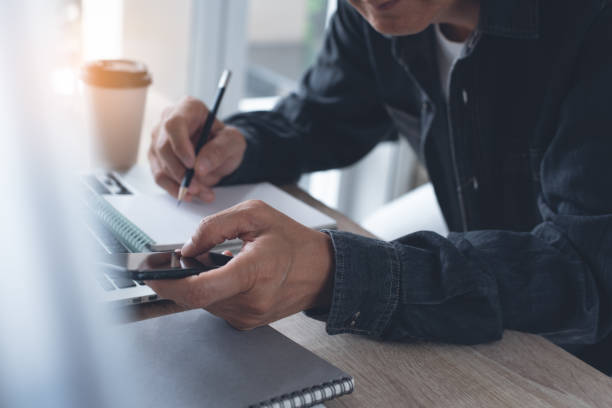 istock Businessman working on laptop computer from home 1346867893