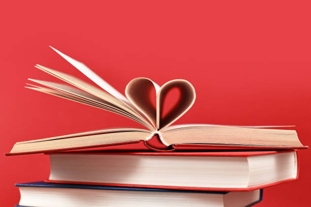 istock Pages of book folded into heart shape 1346869241