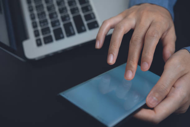 istock Business woman using mobile phone and working on laptop 1346869769