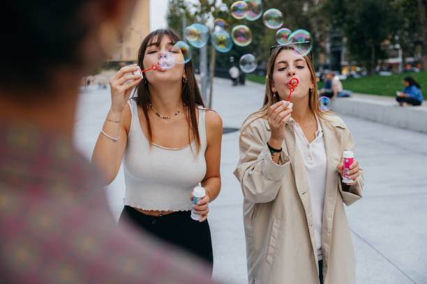 istock Happy friends generation Z having fun outdoors 1346873016