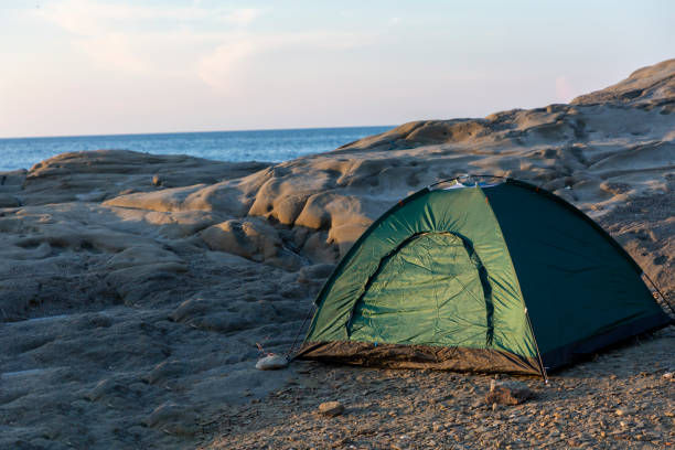 istock Camping on the cliffs by the sea at sunset 1346873817