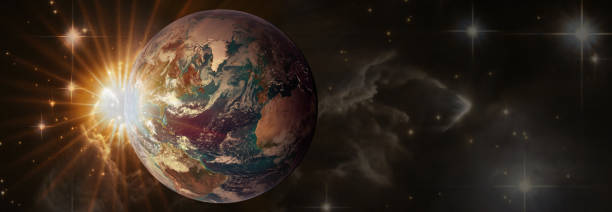 istock Sunrise with lens flare. Beautiful planet Earth in space in sun rays with copy space, panoramic view. Elements of this image furnished by NASA. 1346876063