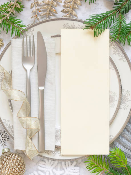 istock Festive table setting of with fir tree branches and Christmas decorations. Menu card mockup 1346877338