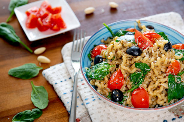 istock Fusilli lunghi ,cherry tomato, black olive and spinach. 1346880583