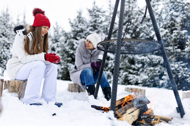 istock Mother and daughter enjoying small bonfire in the backyard 1346884048