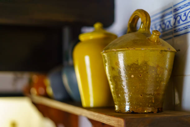 istock Clay and ceramic containers on shelves with a general vintage look. 1346885162