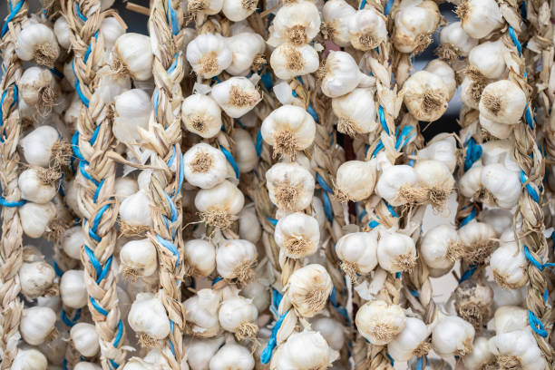 istock Garlic in wreaths hangs on the wall 1346886169