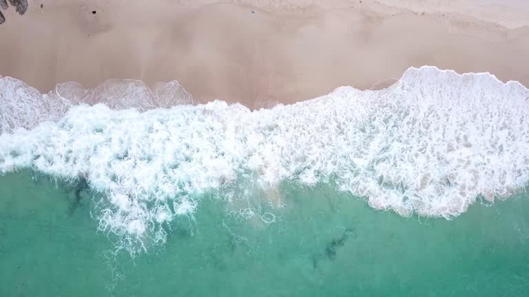 Aerial view of Tropical Beach and wave with white sand and blue sea