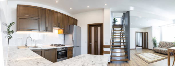 istock Modern wooden kitchen in scandinavian interior with cooking appliances. Real image 1346888941