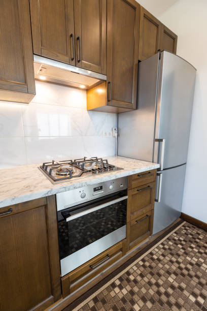 istock Modern kitchen oven in scandinavian interior with cooking appliances. Real image 1346889113