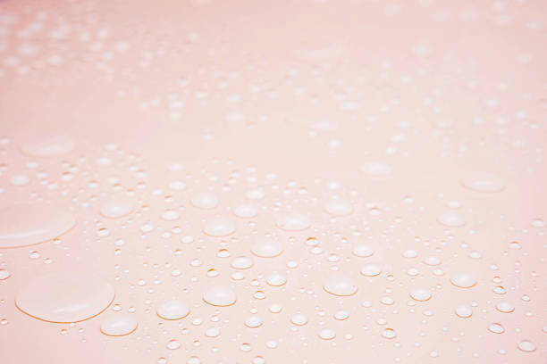 istock Water droplets abstract textured background, selective focus, close up. 1346891283