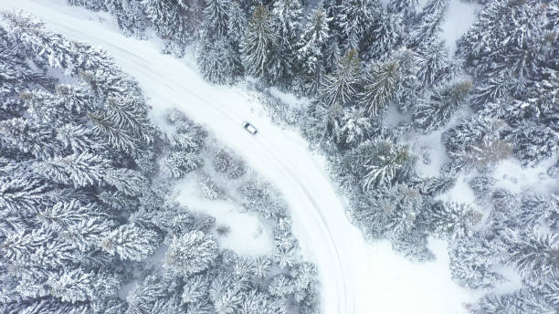 istock Car driving on winter country road 1346892459