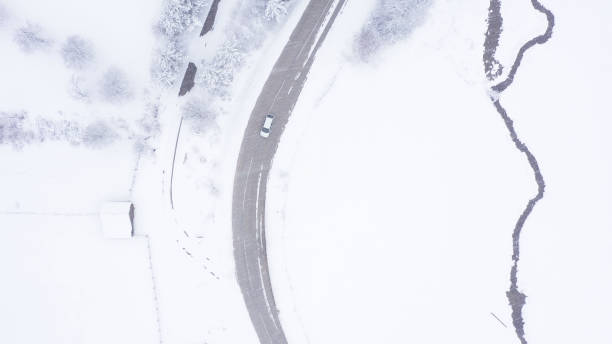 istock Car driving on winter country road 1346892467