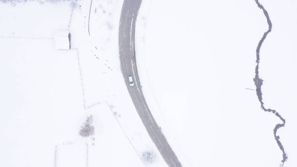 istock Car driving on winter country road 1346892471