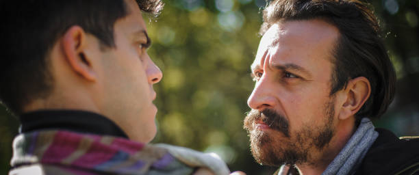 istock Angry, nervous and upset men in an aggressive quarrel conflict 1346894504