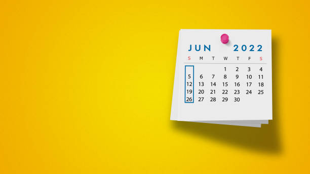 2022 June Calendar on Note Pad Against Yellow Background 2022 June calendar on a white note paper pinned on wall against yellow background. High resolution and copy space for all your crop needs. june stock pictures, royalty-free photos & images