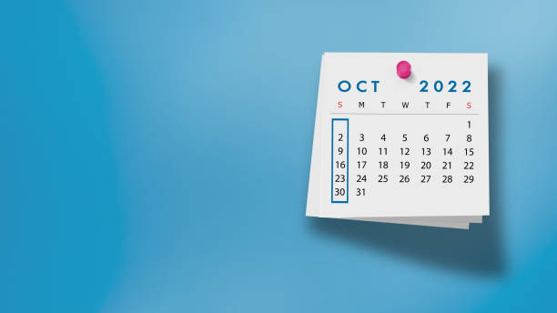 istock 2022 October Calendar on Note Pad Against Blue Background 1346897722