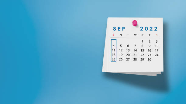 istock 2022 September Calendar on Note Pad Against Blue Background 1346898301