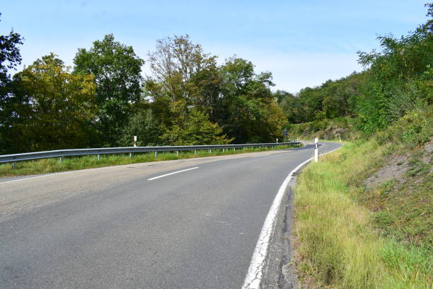 istock twisted road in the Eifel during autumn 1346898338